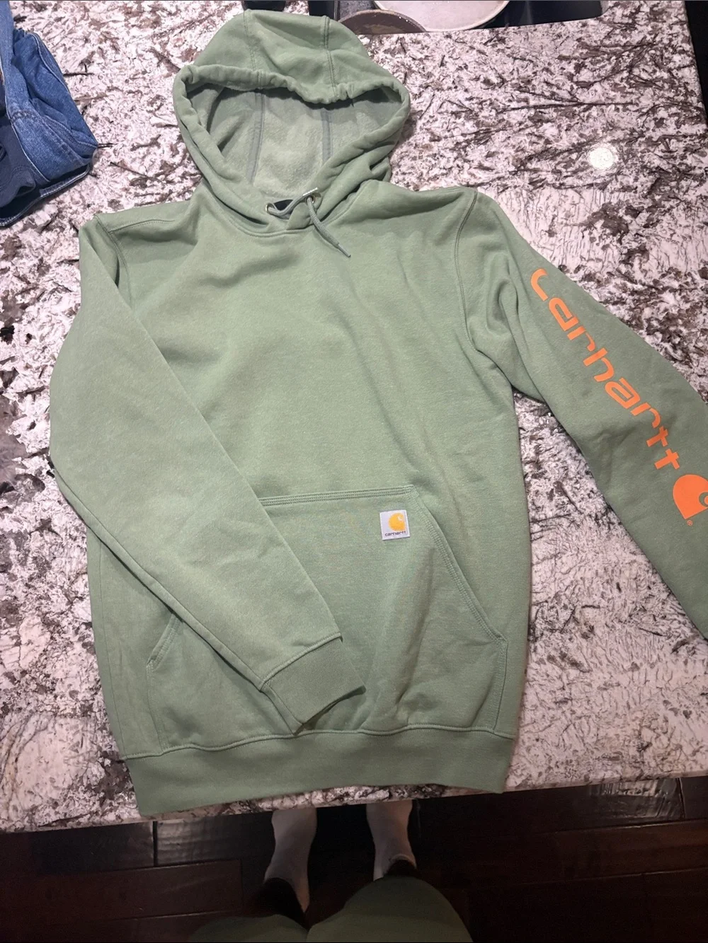 Carhartt Men’s Sage Green Hoodie with Orange Sleeve Logo